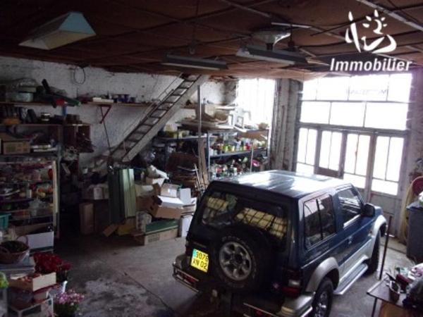 UNE MAISON A USAGE D'HABITATION