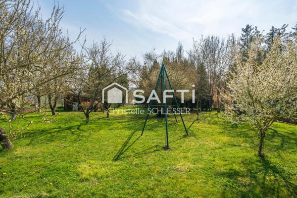 Maison de Plain-Pied au Cœur d'un Écrin de Verdure