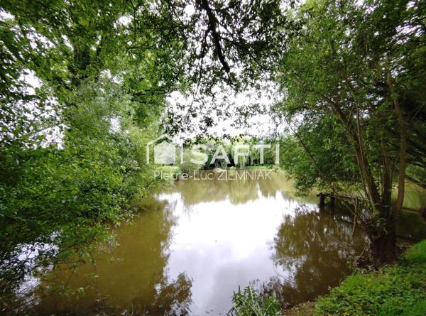 Terrain de loisirs avec étang et mobil-home – 4100 m² clos à Houssay (53360)