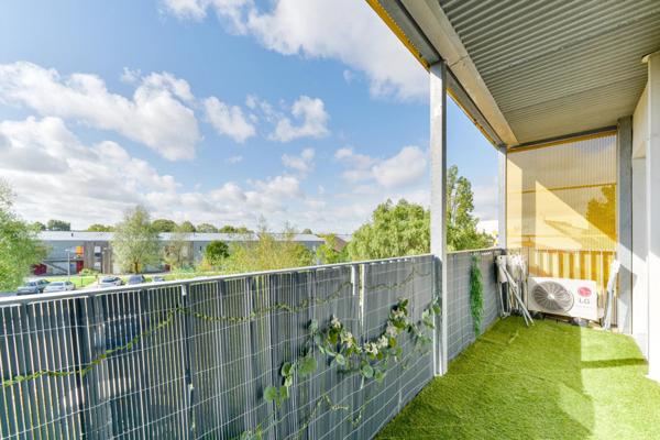 Appartement lumineux avec balcon et 2 places de parking