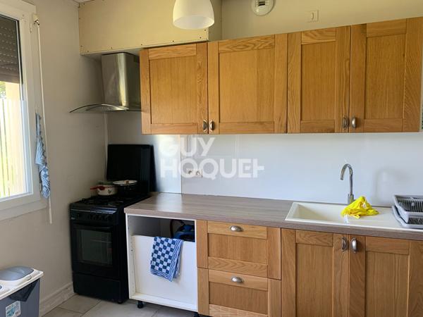 Maison divisée en 2 appartements