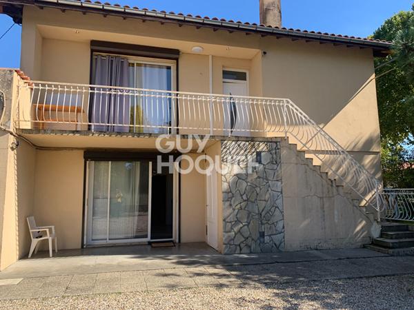 Maison divisée en 2 appartements