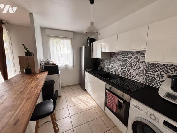 MONDEVILLE / APPARTEMENT DE TYPE F3 EN REZ DE JARDIN