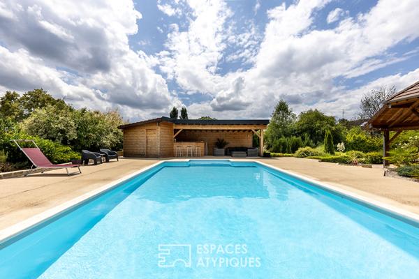 Maison familiale avec piscine et vue dégagée dans un cadre paisible