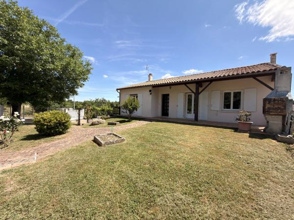 Charmante maison de plain-pied avec garage et jardin clos