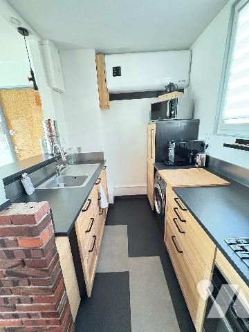 ROUEN, appartement de 50.92 m², 1 chambre, garage, place de parking dans copropriété.