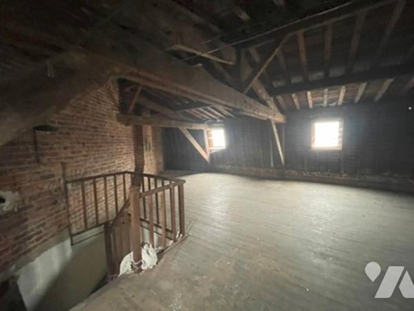 UNE MAISON A USAGE D'HABITATION