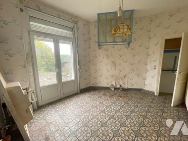 UNE MAISON A USAGE D'HABITATION