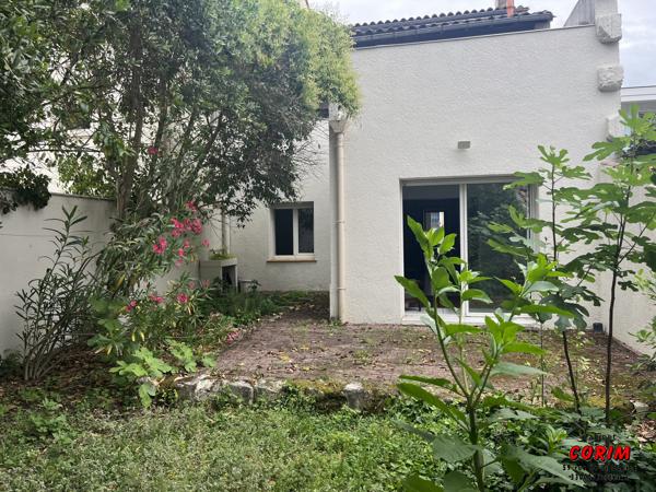 Immeuble de 2 appts (jardin + garage)