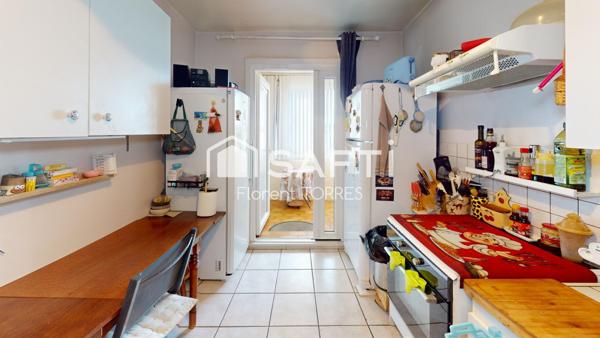 Appartement 86m² Faux T4 + stationnement privatif