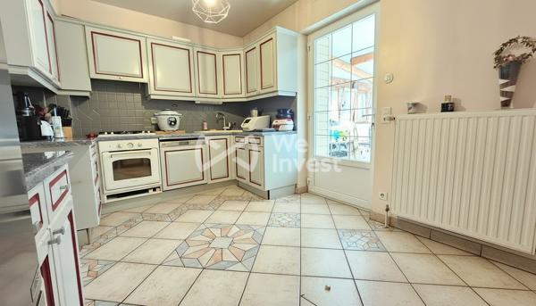 Maison de ville sur sous-sol complet avec véranda, jardin et garage à Épinal