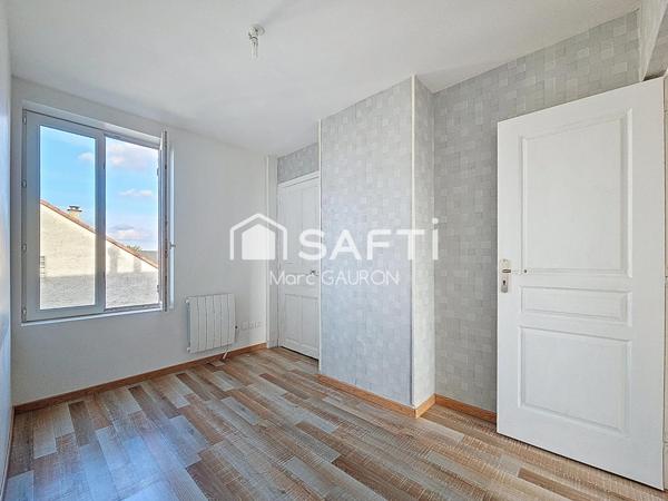 Appartement de 75m² avec parking fermé, combles a aménager et cave.