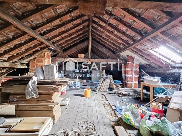 Appartement de 75m² avec parking fermé, combles a aménager et cave.