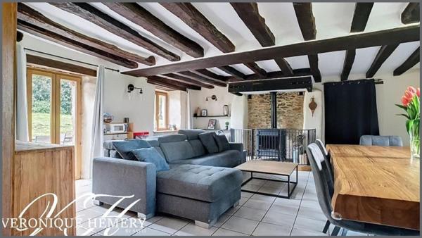 Un havre de paix pour cette charmante chaumière sise sur 1,4 ha