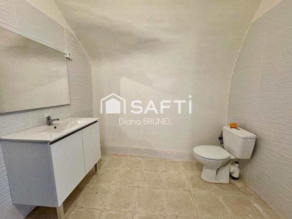 Immeuble comprenant local commercial et appart T4