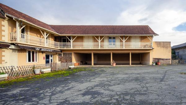 Immeuble ancien hôtel 600 m² + terrain à bâtir 1 909 m² – potentiel division – Denguin