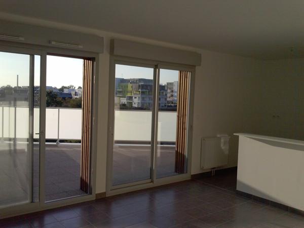 appartement 64m² + balcon 50m² + 2 places parking