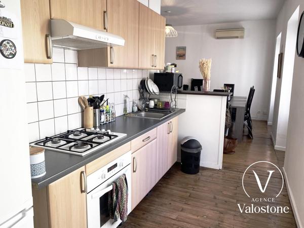 Immeuble commercial + 2 appartements