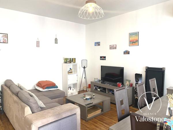 Immeuble commercial + 2 appartements