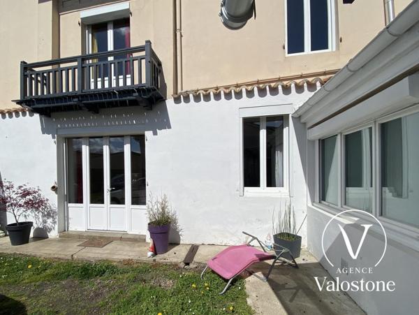 Immeuble commercial + 2 appartements