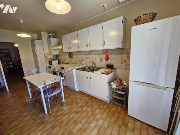 Appartement T4 en rez-de-jardin + place de parking privative