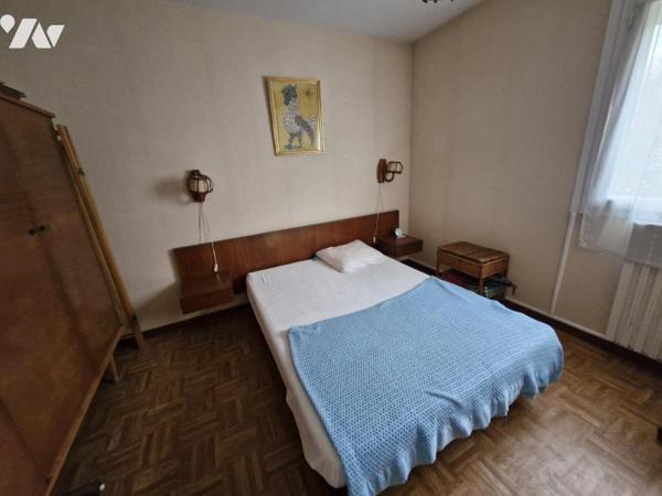 Appartement T4 en rez-de-jardin + place de parking privative