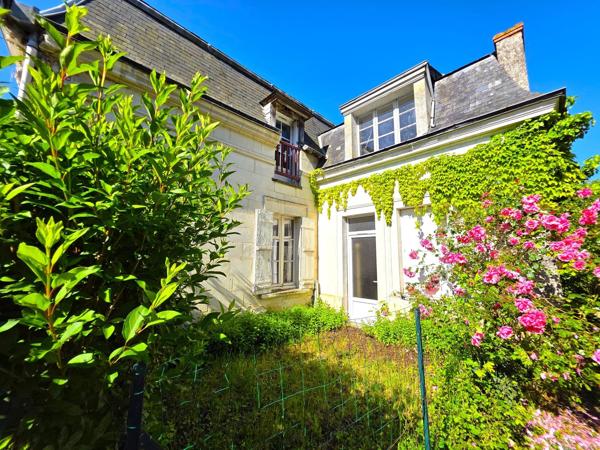 Maison de village avec double garage, dépendances et terrain arboré