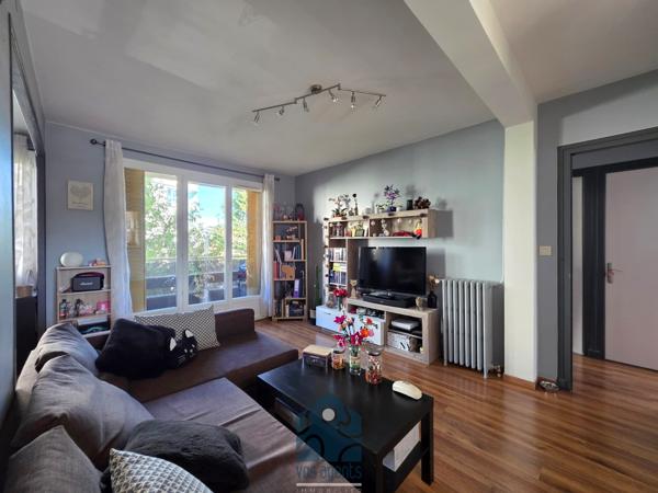 Appartement 4 pièces avec balcon, garage, stationnement et cave