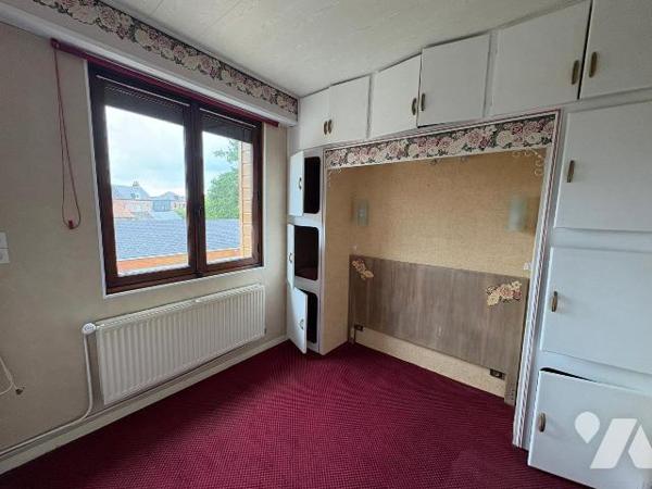 A proximité immédiate du centre-ville, dans un quartier calme, Maison comprenant:
Au rez-de-ch...