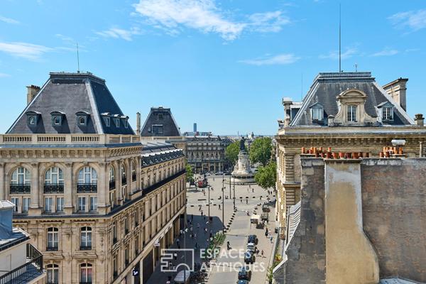 Dernier étage traversant avec vue sur les toits et le Sacré Coeur