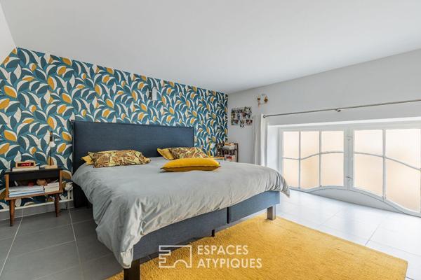 Duplex de caractère avec toit-terrasse à quelques pas de la gare