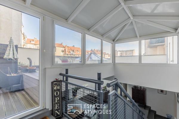 Duplex de caractère avec toit-terrasse à quelques pas de la gare