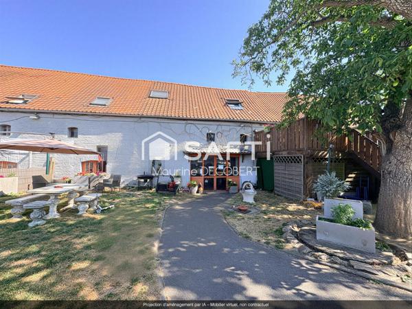 Ensemble immobilier comprenant 1 local commercial et un appartement sur un axe principal