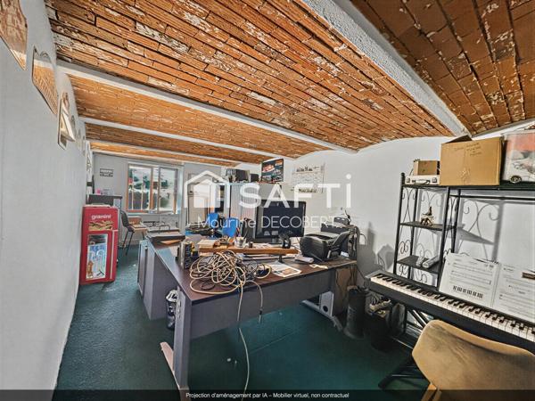 Ensemble immobilier comprenant 1 local commercial et un appartement sur un axe principal