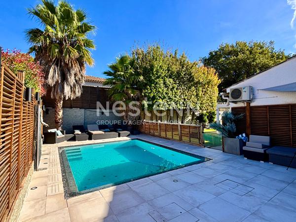 Maison de type 4 d'environ 126m² avec véranda, jardin, piscine et garage