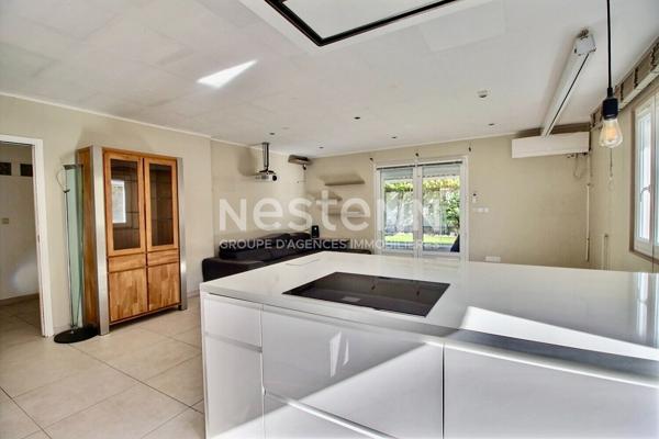 Maison de type 4 d'environ 126m² avec véranda, jardin, piscine et garage