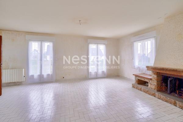 Maison sur sous sol proche du centre sur terrain de 1000 m² constructible