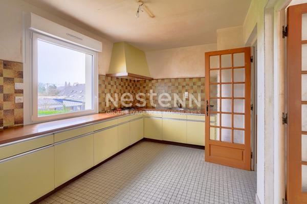 Maison sur sous sol proche du centre sur terrain de 1000 m² constructible