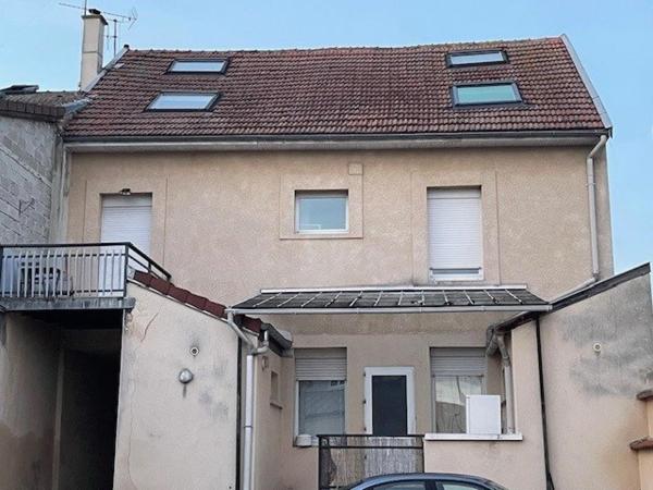 A vendre à Reims un appartement loué et une place de parking