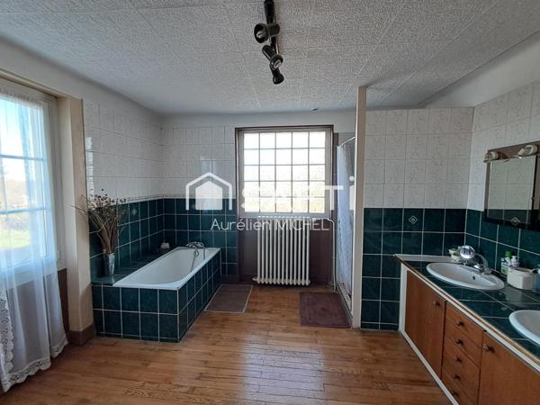 GRANDE MAISON FAMILIALE AVEC POTENTIEL DE DEVELOPPEMENT