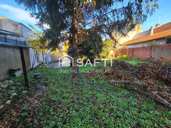 Maison avec garage et jardin