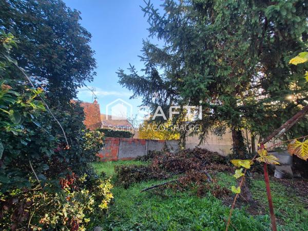 Maison avec garage et jardin