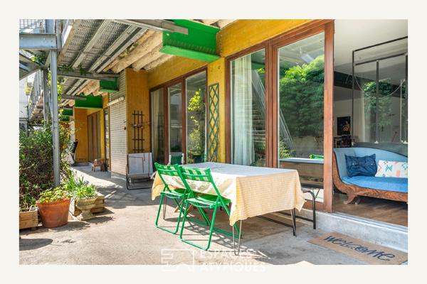 Loft sur jardin verdoyant dans une ancienne boutonnerie