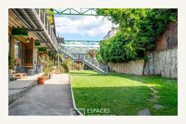 Loft sur jardin verdoyant dans une ancienne boutonnerie
