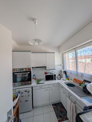 Appartement T2 avec locataire en place - Résidence sécurisée avec ascenseur, parking et cave