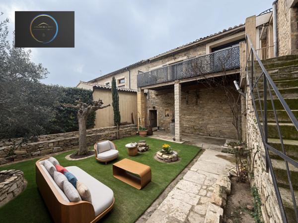 Marguerittes (30320) Maison de ville atypique T4, avec garage double , et avec parcelle de terrain arborée .