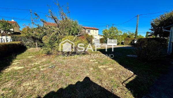 Maison avec jardin, garage et potentiel de deux logements