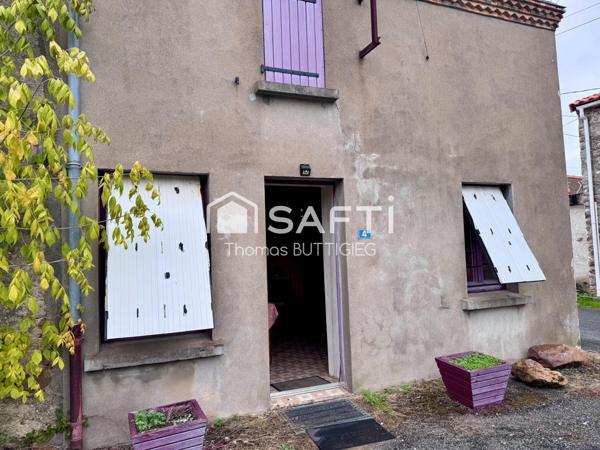 Maison de village avec grange et atelier.