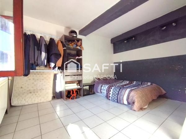 Maison de ville en pierre 7 pièces – 122 m² habitables – Cessieu