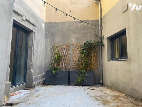 Appartement rez-de-chaussée climatisé avec cour intérieure et cave